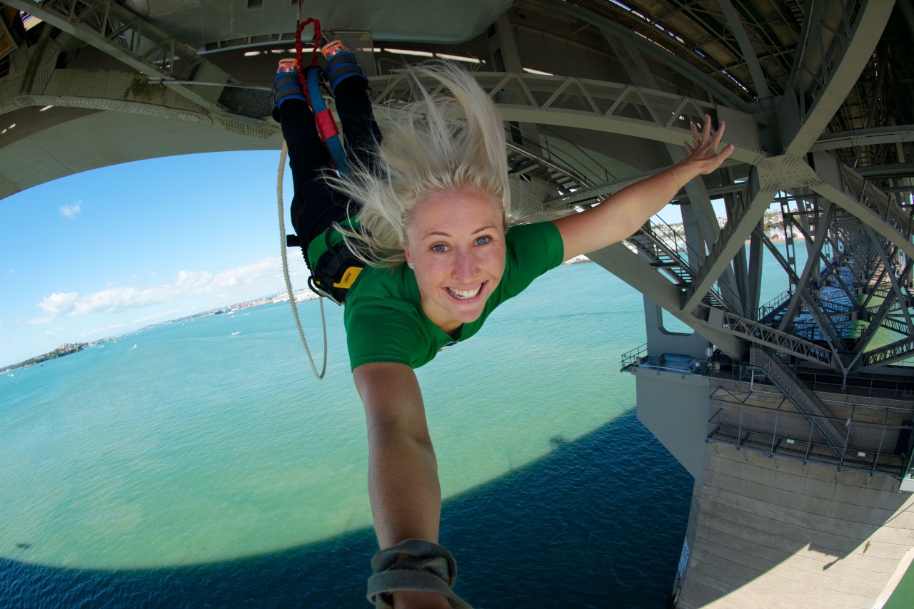 A woman bungy jumping from Auckland Harbour Bridge