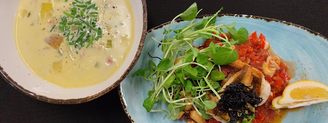 Two beautifully presented seafood dishes - Auckland Seafood School