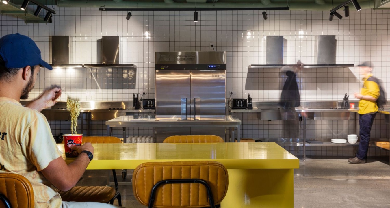 People enjoying LyLo's communal kitchen