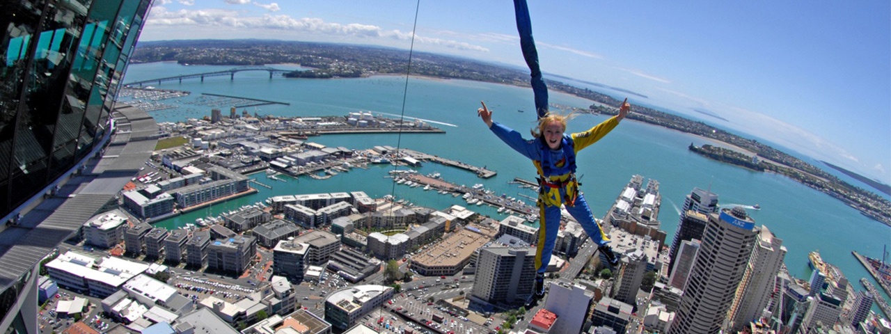 A girl on the Auckland Sky Tower SkyJump